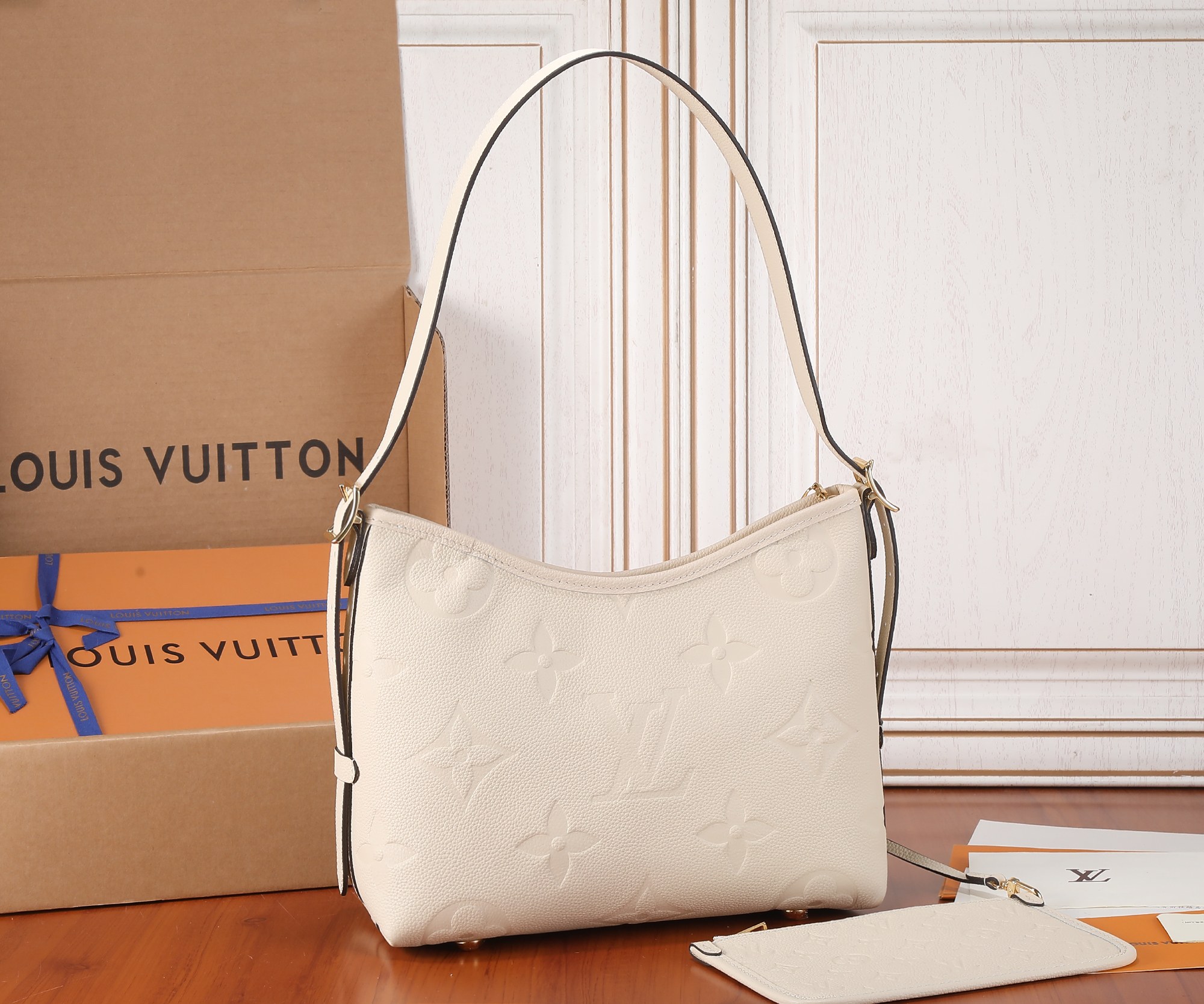 Carryall Pm Bag Monogram Empreinte Leather Cream M46288