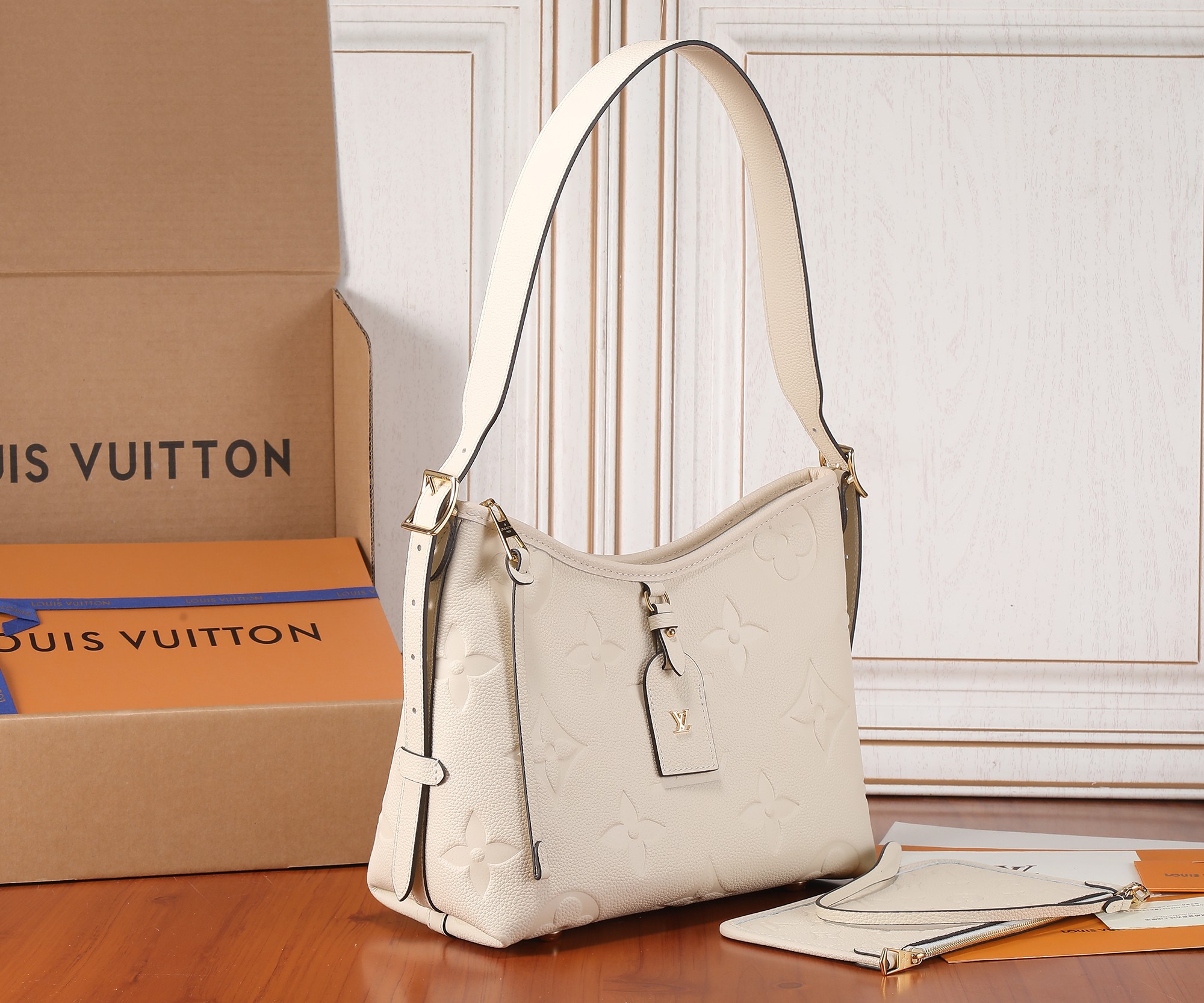 Carryall Pm Bag Monogram Empreinte Leather Cream M46288
