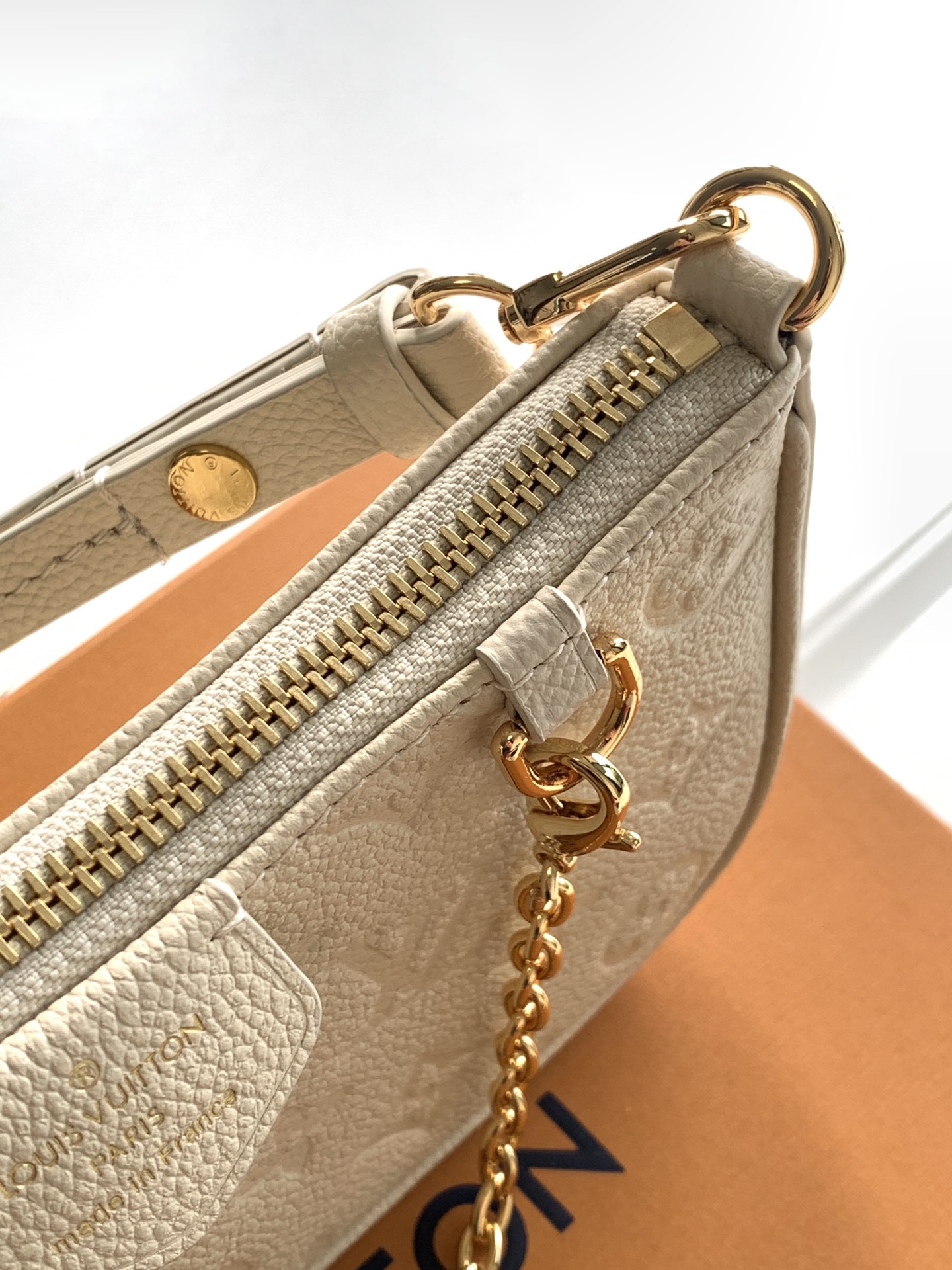 Easy Pouch On Strap Cream Embossed Monogram Empreinte Cowhide Leather M81066