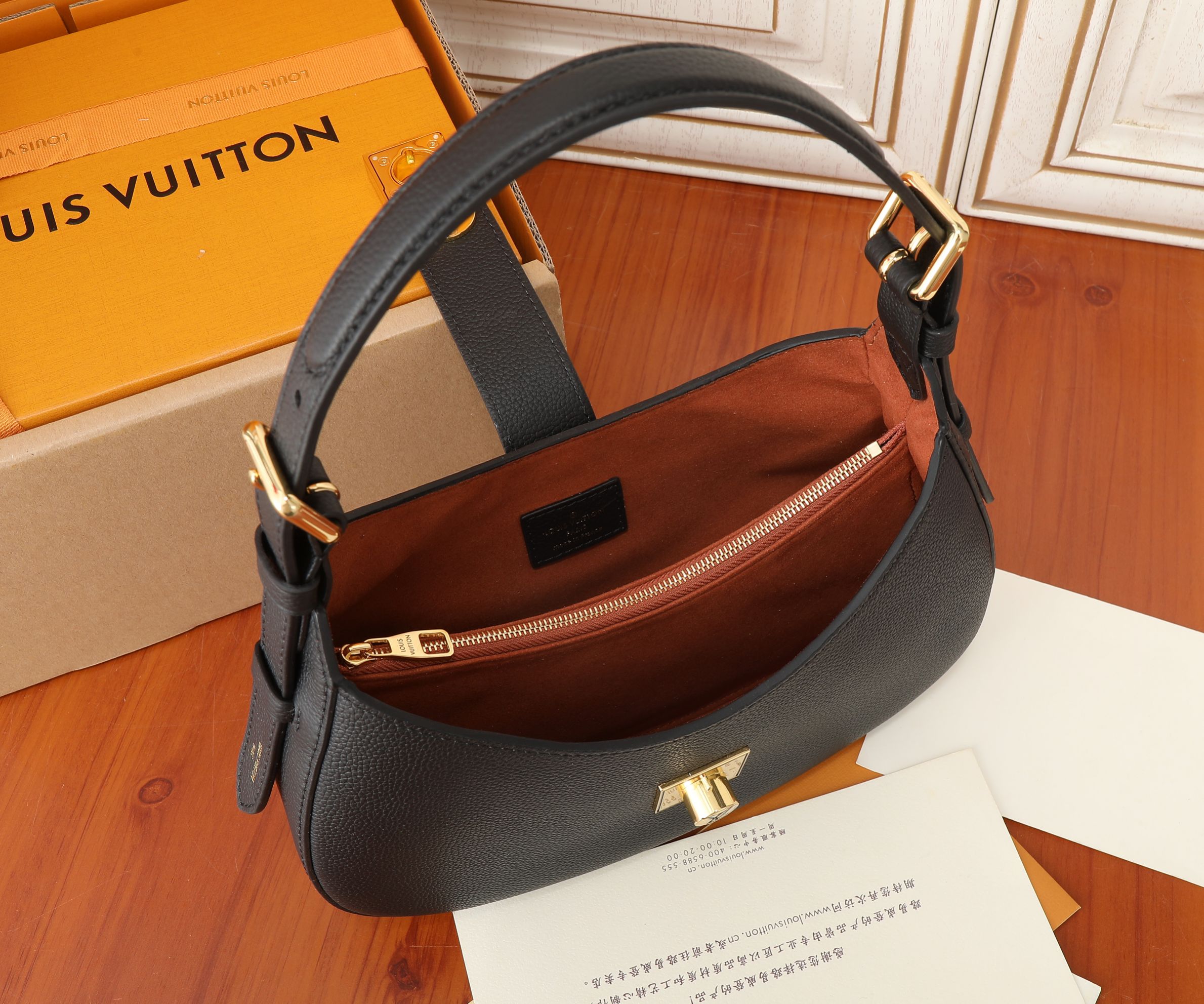 Low Key Shoulder Bag Black Grained Calfskin M24611
