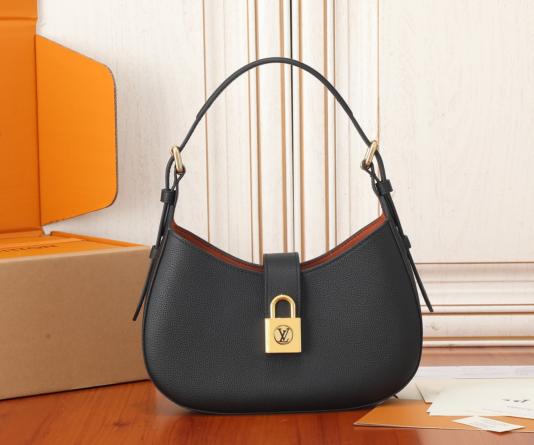 Low Key Shoulder Bag Black Grained Calfskin M24611