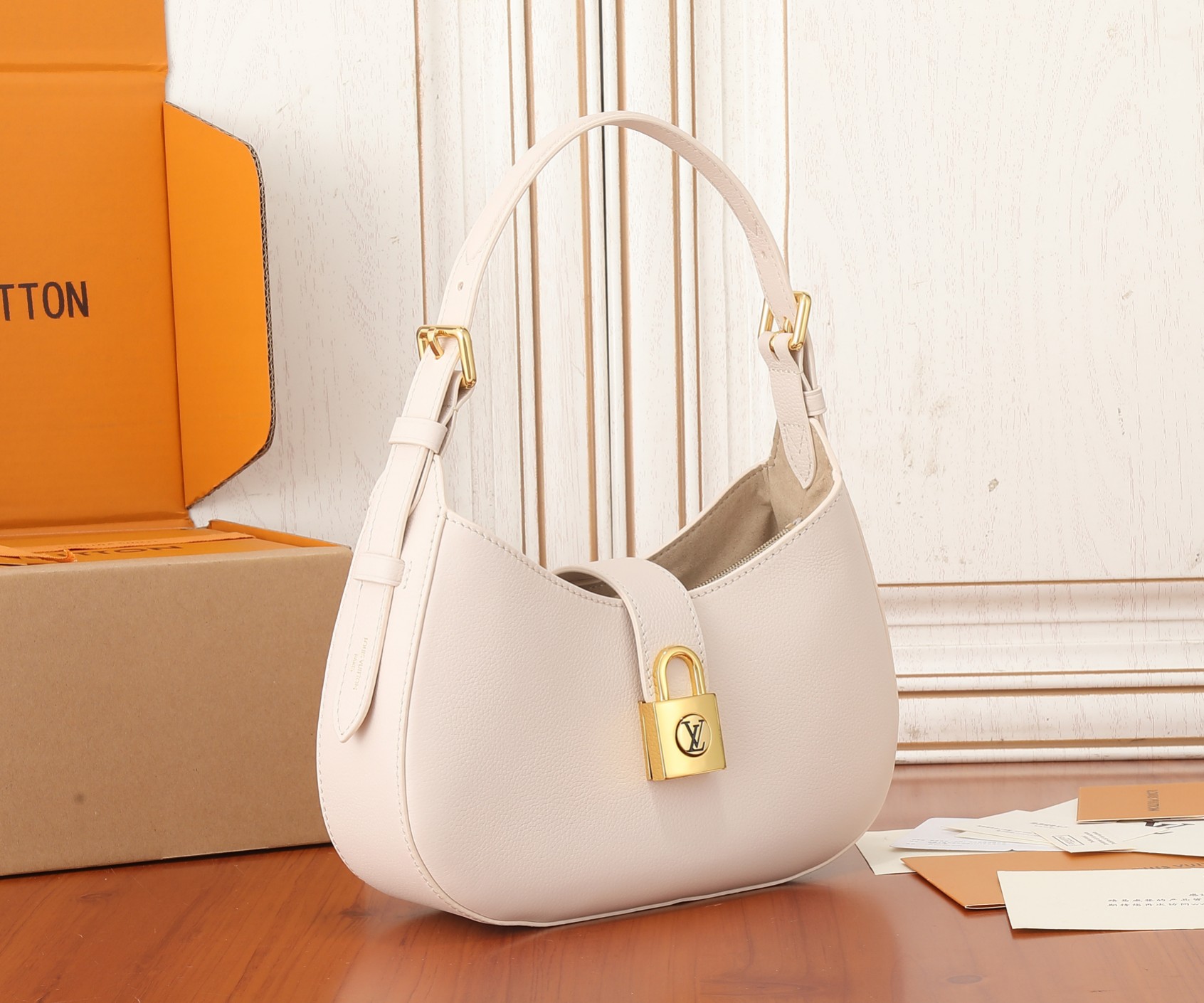 Low Key Shoulder Bag Limestone Gray Grained Calfskin M24611