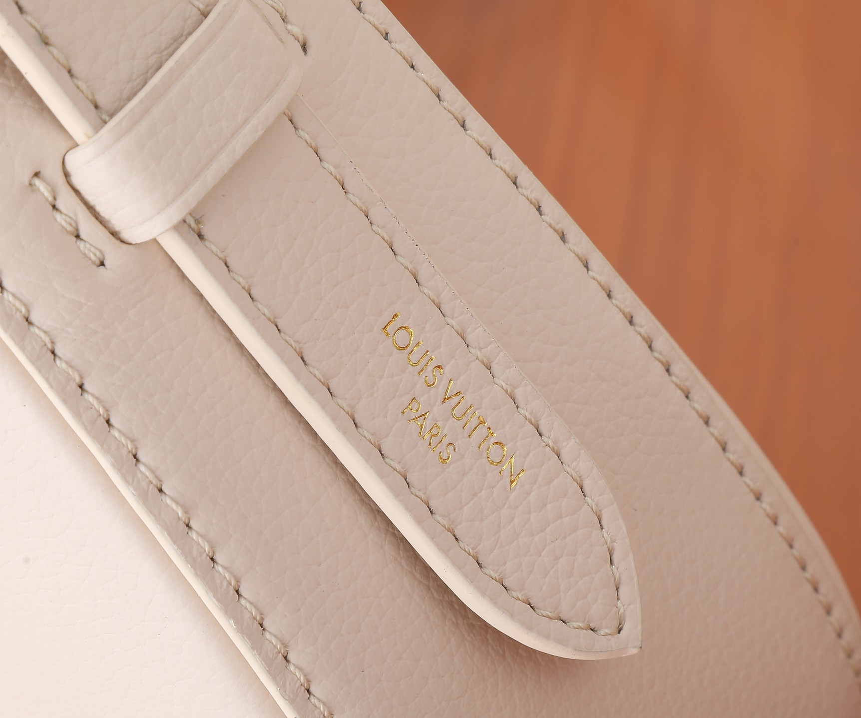 Low Key Shoulder Bag Limestone Gray Grained Calfskin M24611