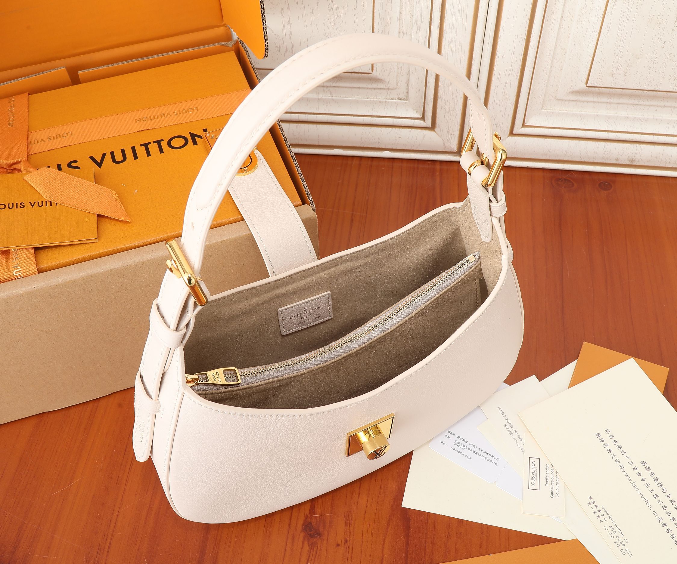 Low Key Shoulder Bag Limestone Gray Grained Calfskin M24611