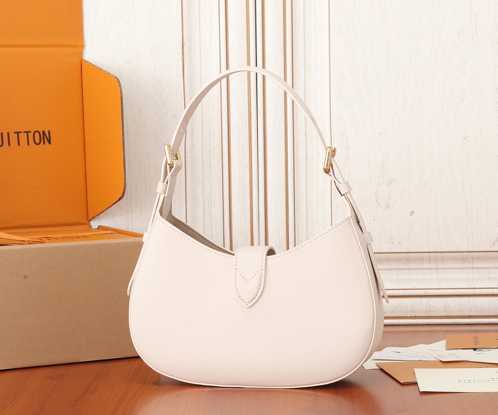 Low Key Shoulder Bag Limestone Gray Grained Calfskin M24611