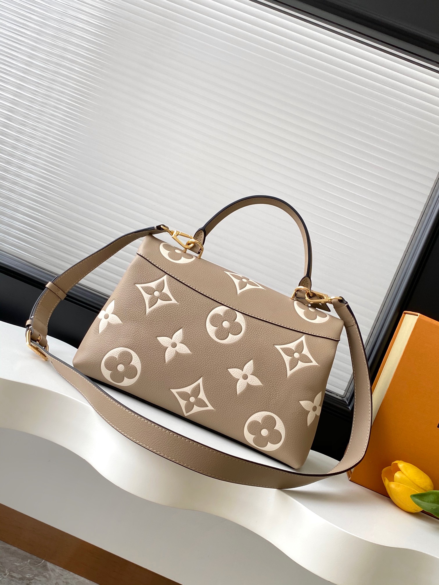 Madeleine Mm Handbag Bicolor Monogram Empreinte Leather Dove Gray / Crème Beige M46041