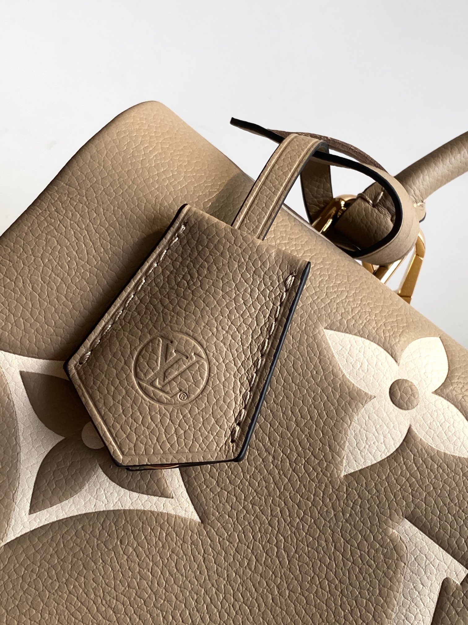Madeleine Mm Handbag Bicolor Monogram Empreinte Leather Dove Gray / Crème Beige M46041