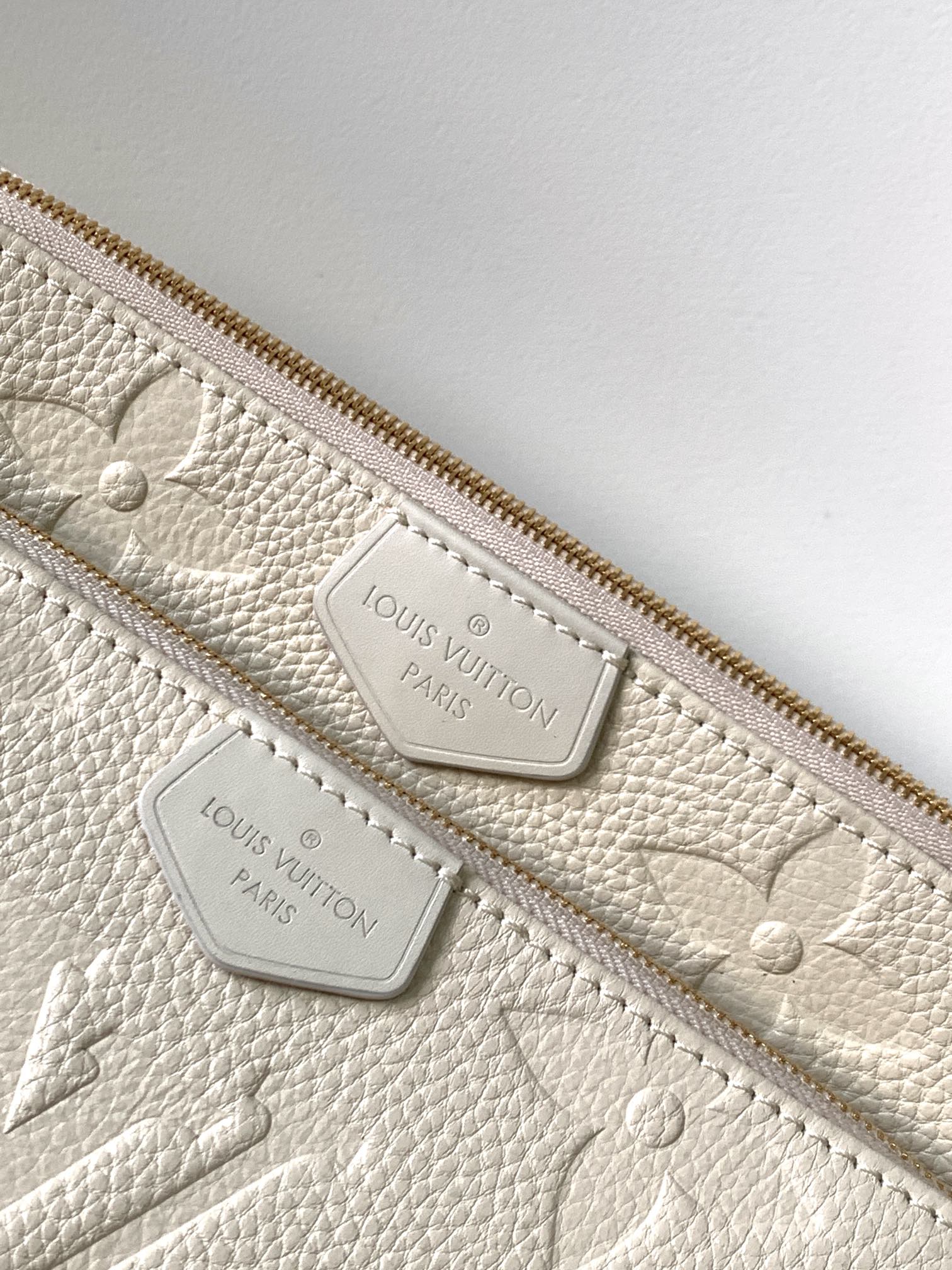Multi Pochette Accessoires Monogram Empreinte Leather Cream M46568