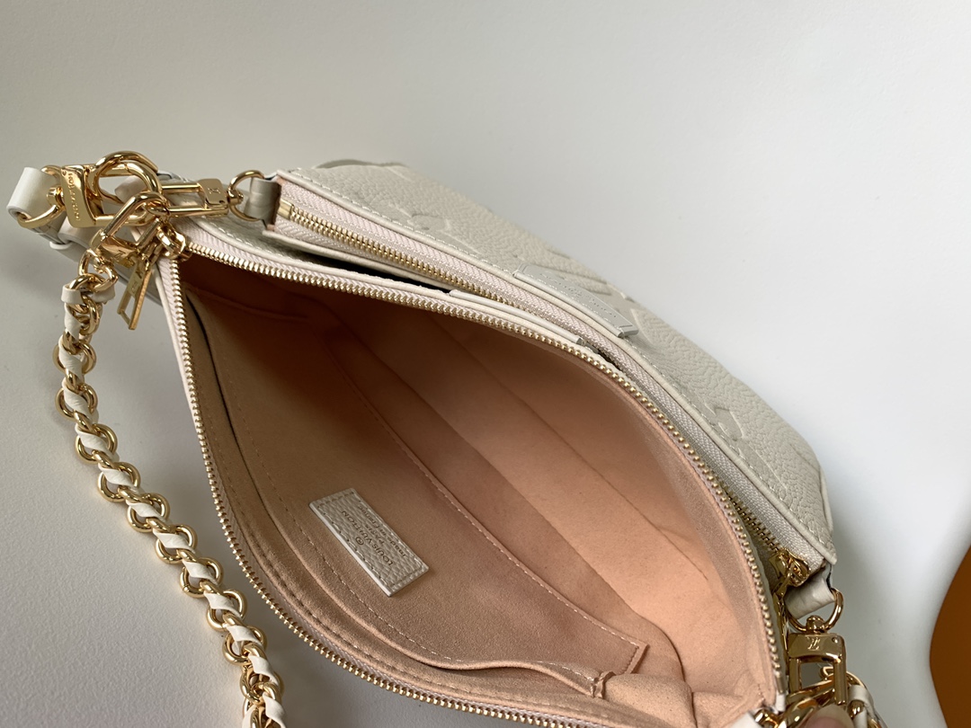 Multi Pochette Accessoires Monogram Empreinte Leather Cream M46568