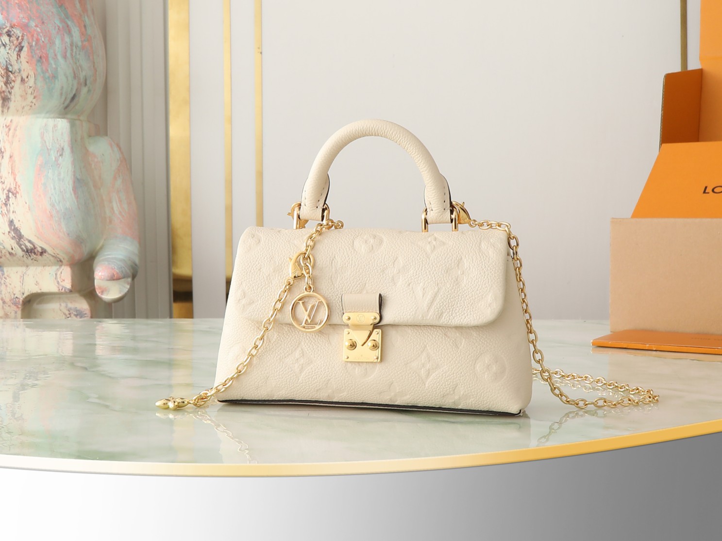 Nano Madeleine Handbag Monogram Empreinte Leather Cream M12145