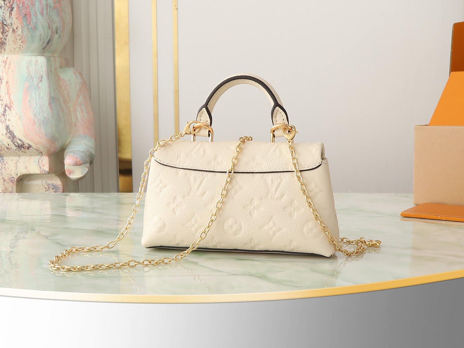 Nano Madeleine Handbag Monogram Empreinte Leather Cream M12145