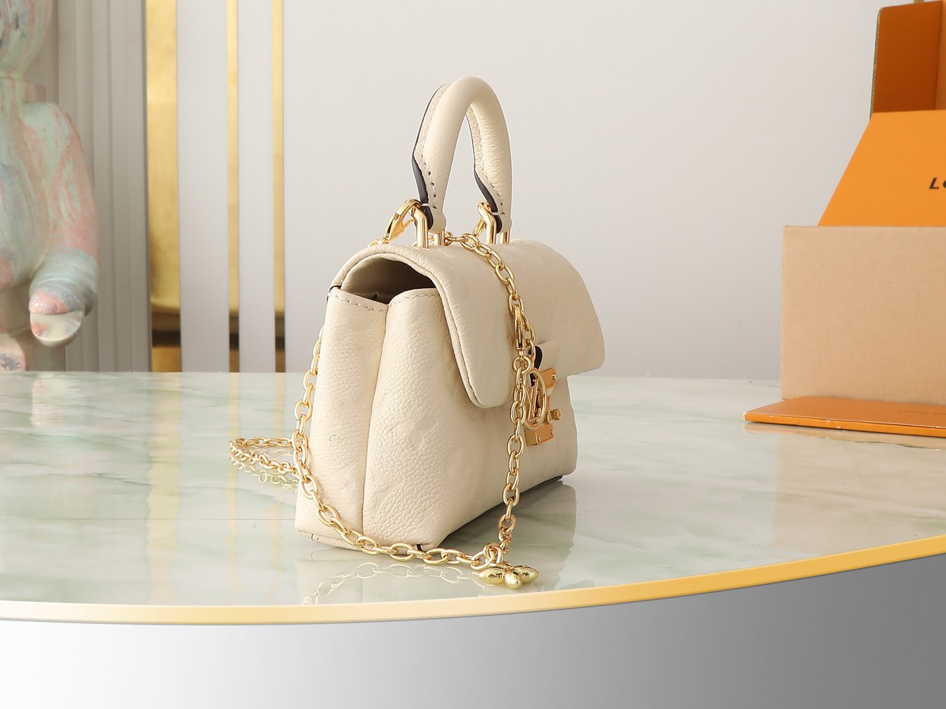 Nano Madeleine Handbag Monogram Empreinte Leather Cream M12145