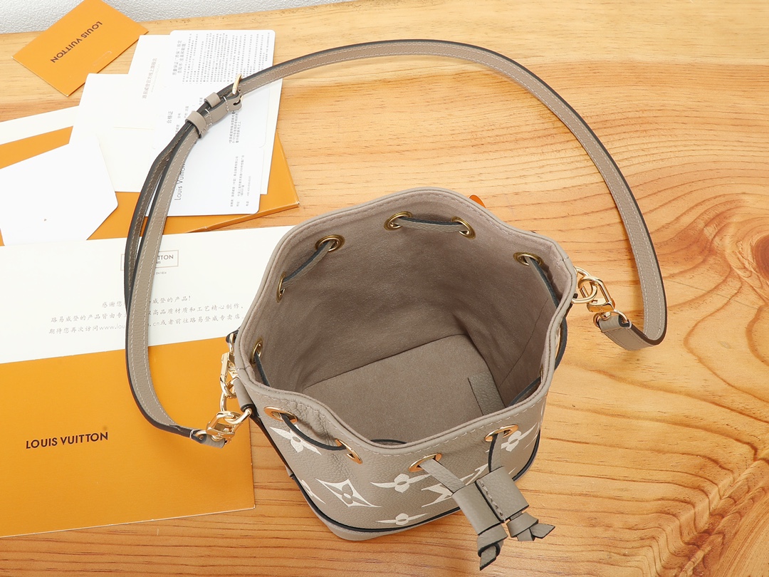 Nano Noé Bucket Bag Bicolor Monogram Empreinte Leather Tourterelle Gray / Cream M46291