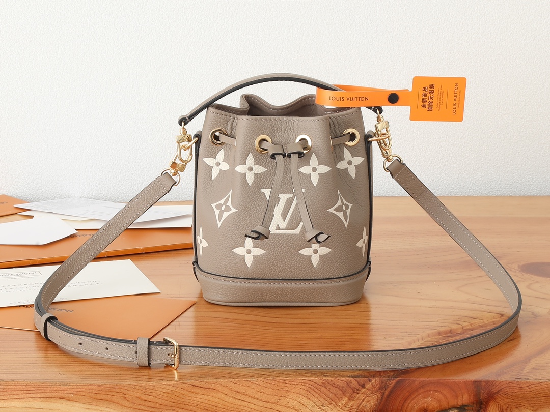 Nano Noé Bucket Bag Bicolor Monogram Empreinte Leather Tourterelle Gray / Cream M46291