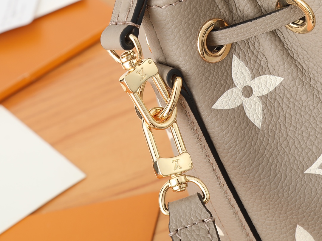 Nano Noé Bucket Bag Bicolor Monogram Empreinte Leather Tourterelle Gray / Cream M46291