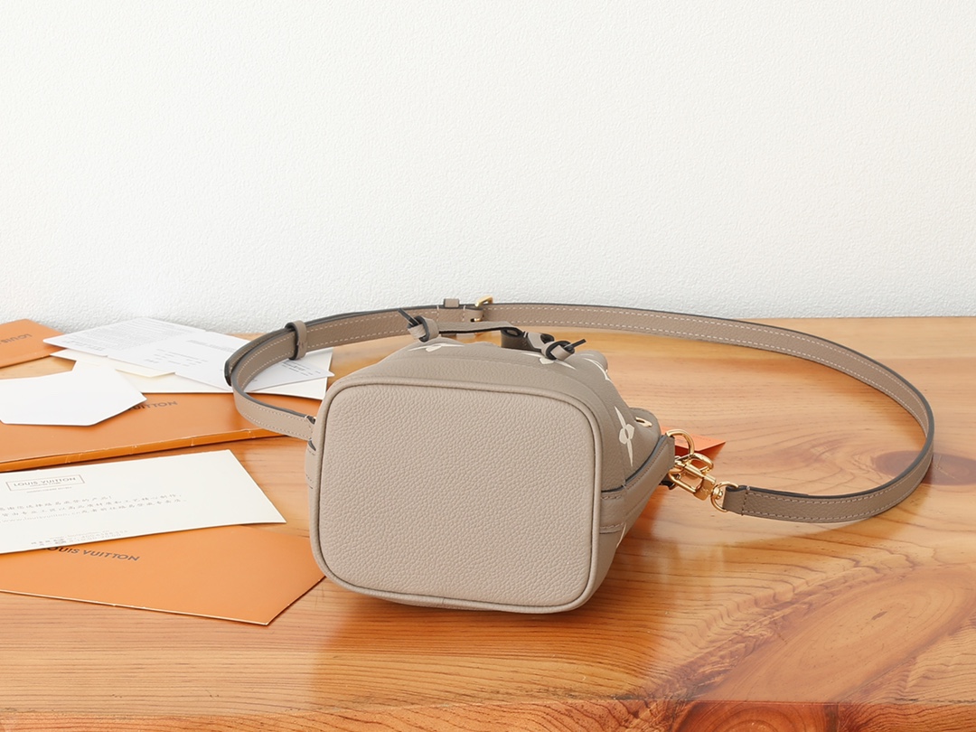 Nano Noé Bucket Bag Bicolor Monogram Empreinte Leather Tourterelle Gray / Cream M46291