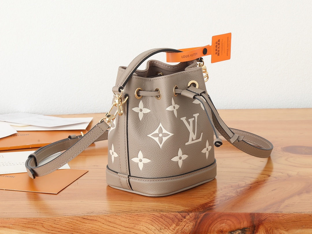 Nano Noé Bucket Bag Bicolor Monogram Empreinte Leather Tourterelle Gray / Cream M46291