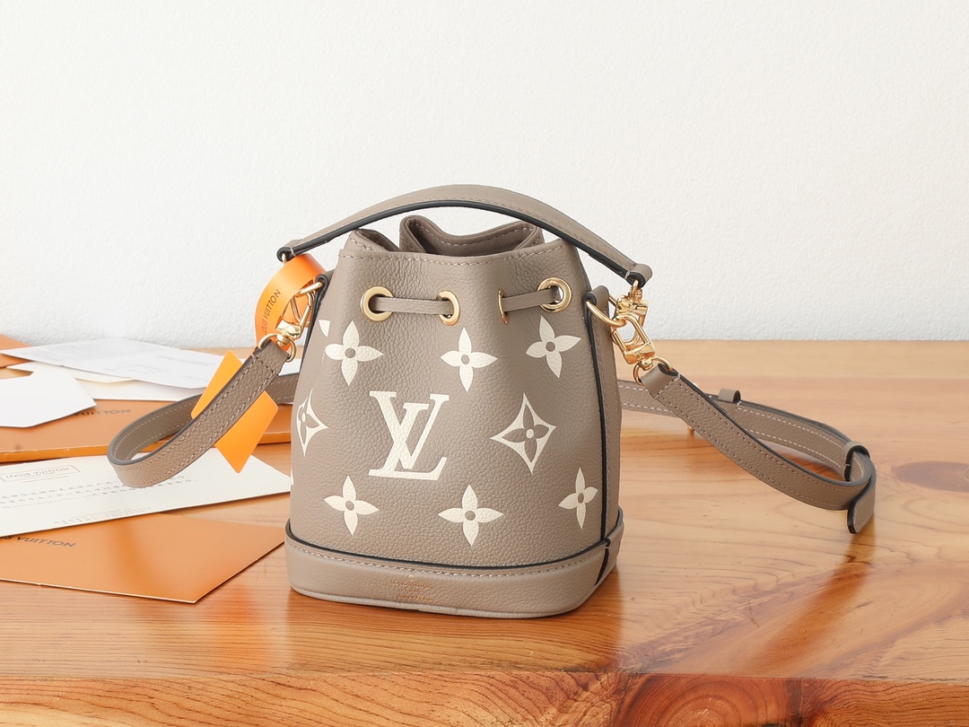 Nano Noé Bucket Bag Bicolor Monogram Empreinte Leather Tourterelle Gray / Cream M46291