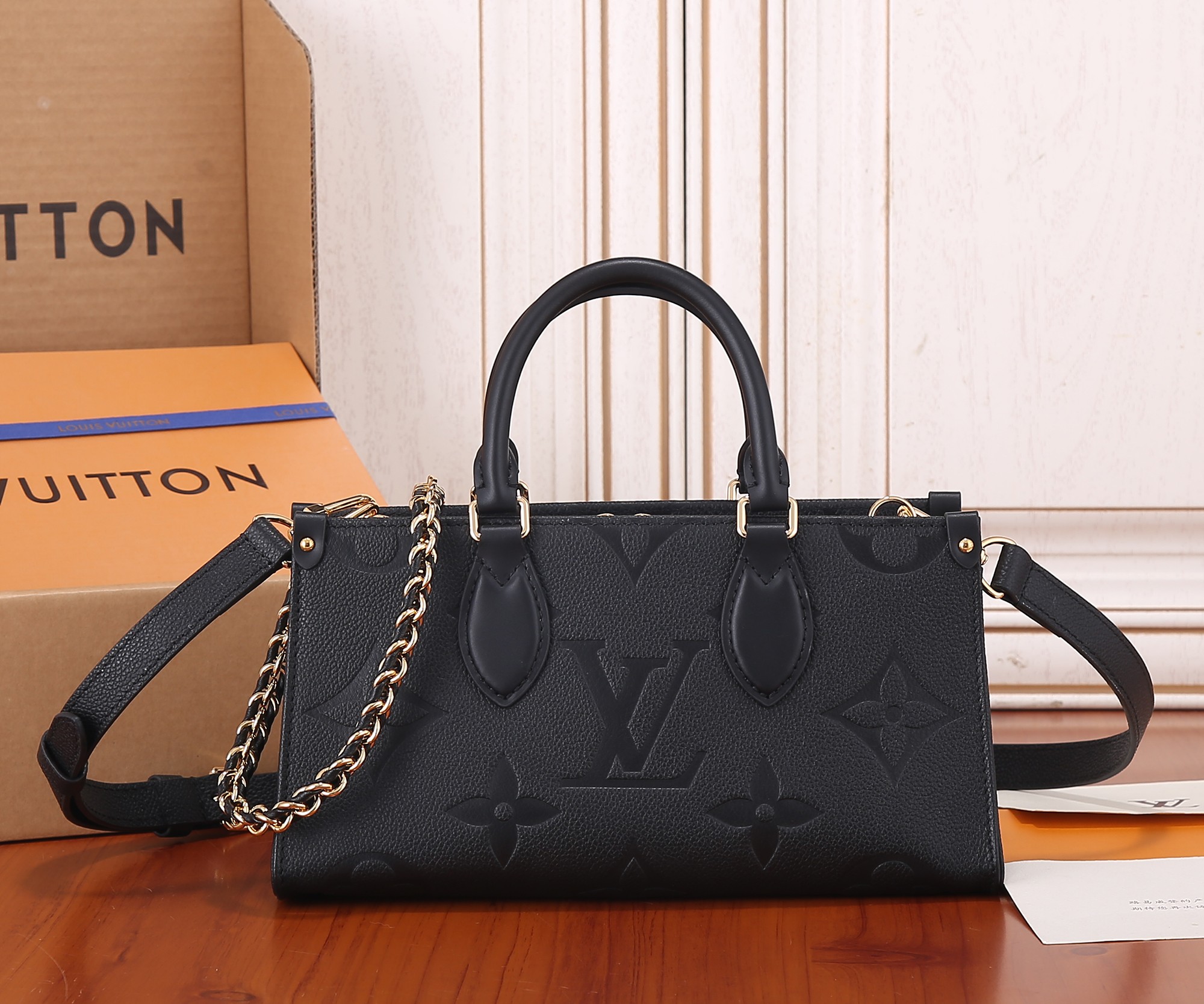 Onthego East West Chain Monogram Empreinte Leather Black M23640