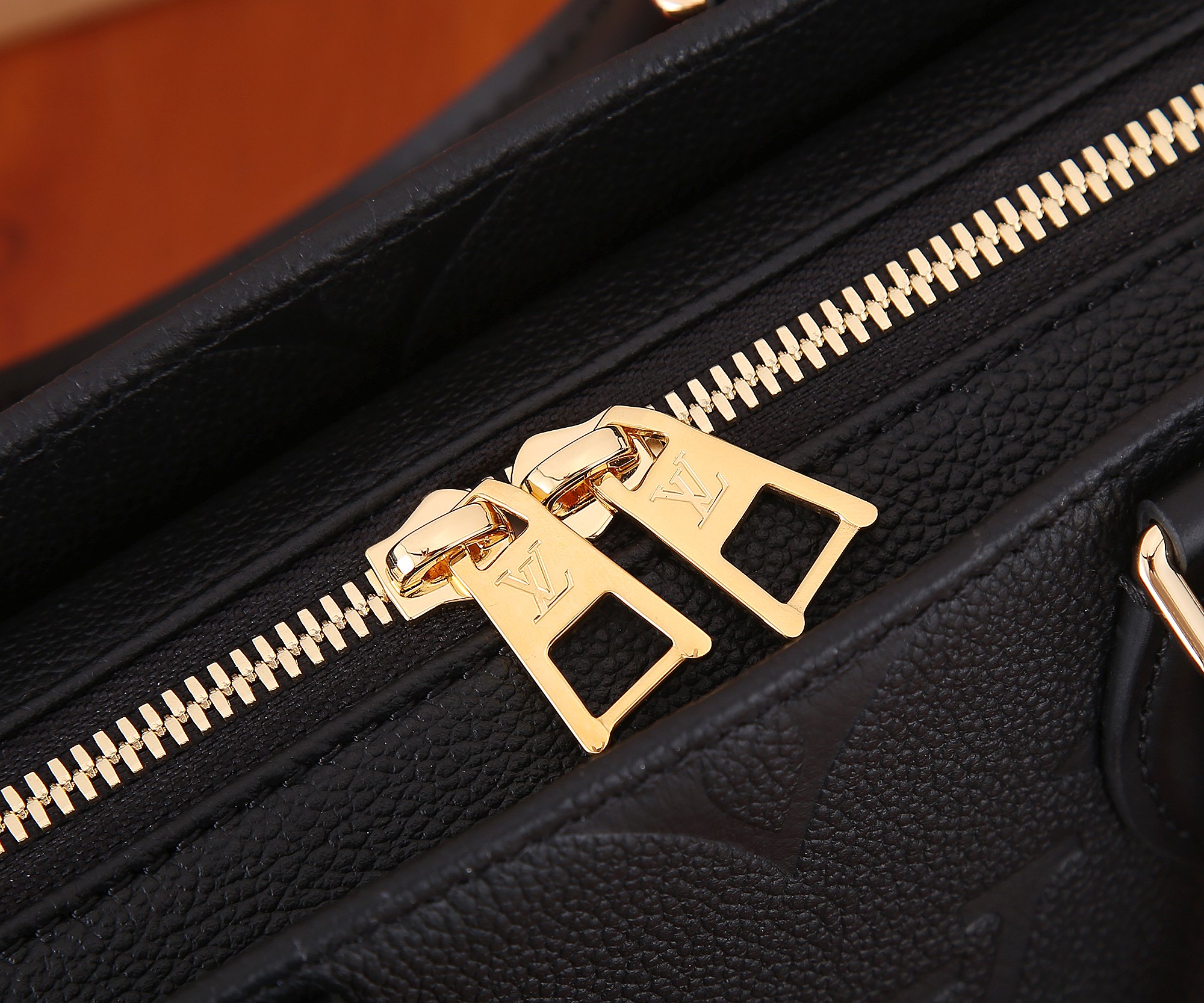 Onthego East West Chain Monogram Empreinte Leather Black M23640