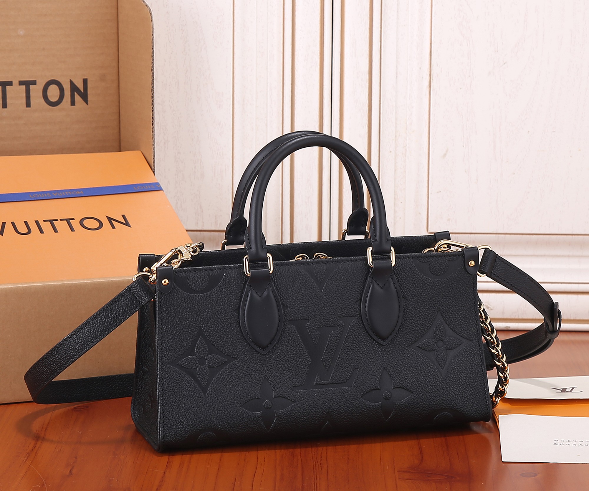Onthego East West Chain Monogram Empreinte Leather Black M23640