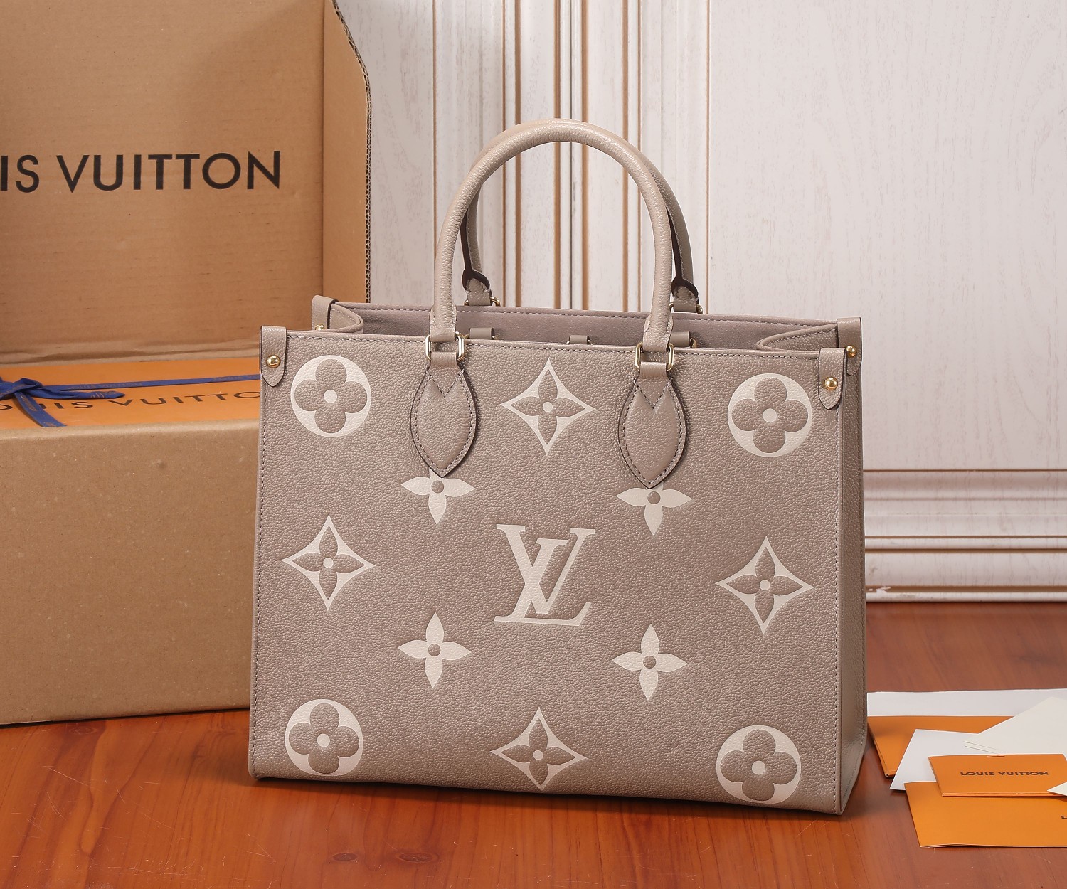 Onthego Mm Bicolor Monogram Empreinte Leather Dove/Cream M45494