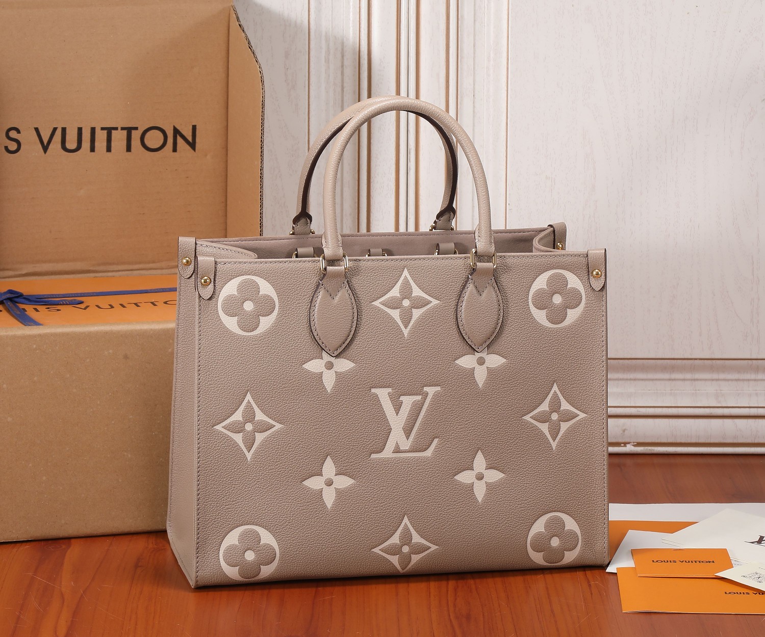 Onthego Mm Bicolor Monogram Empreinte Leather Dove/Cream M45494