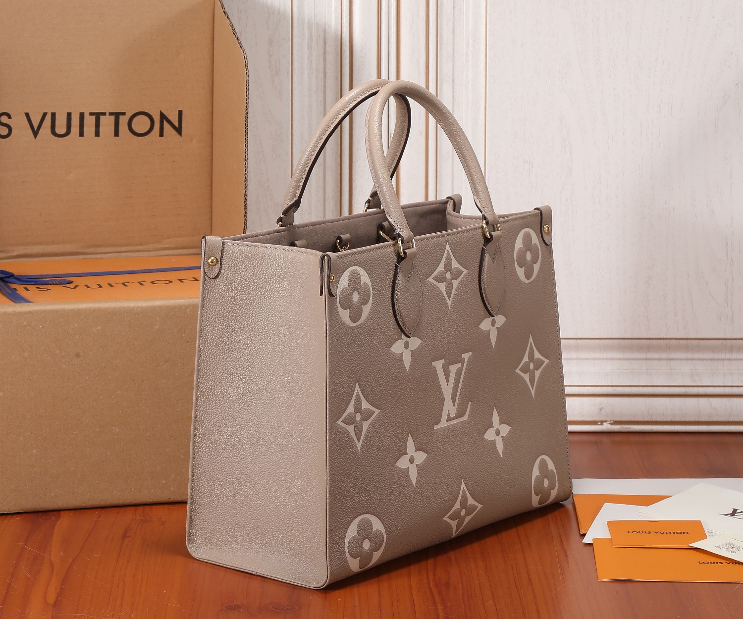 Onthego Mm Bicolor Monogram Empreinte Leather Dove/Cream M45494