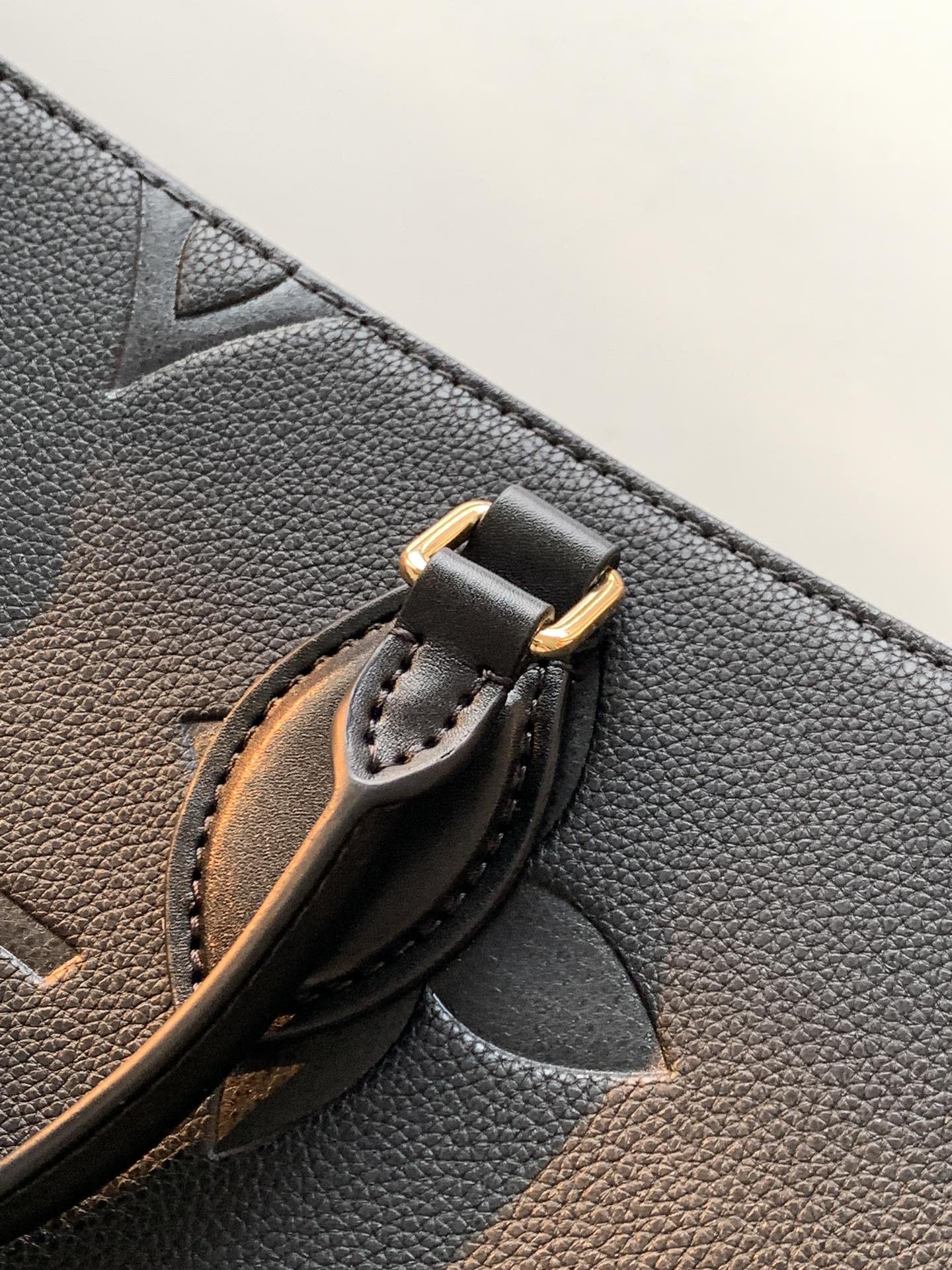 Onthego Mm Monogram Empreinte Leather Black M45595