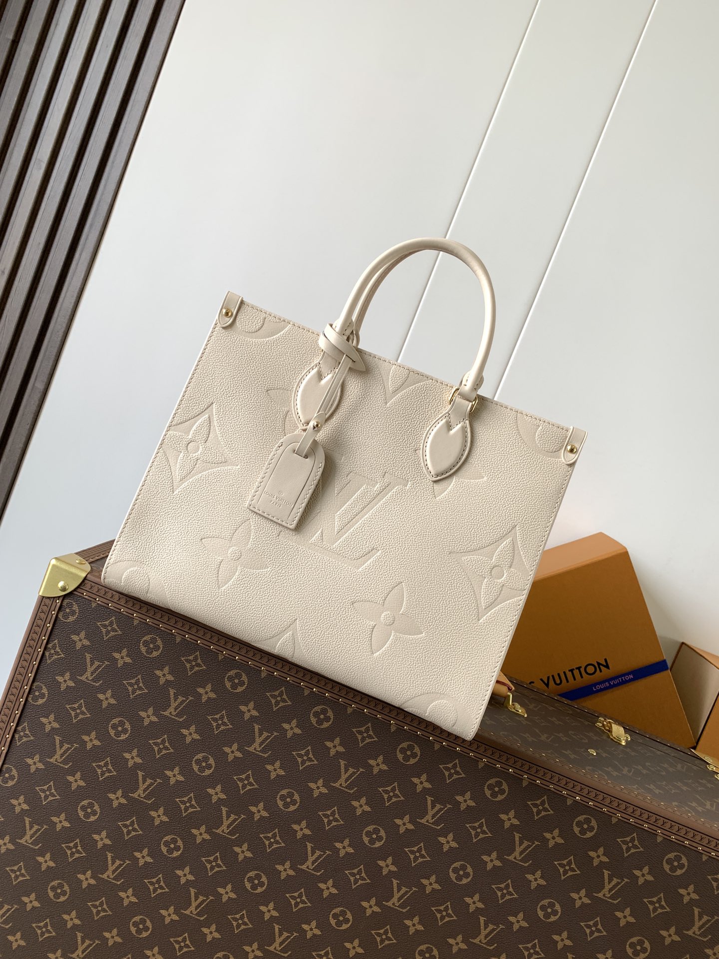 Onthego Mm Monogram Empreinte Leather Sand M14255