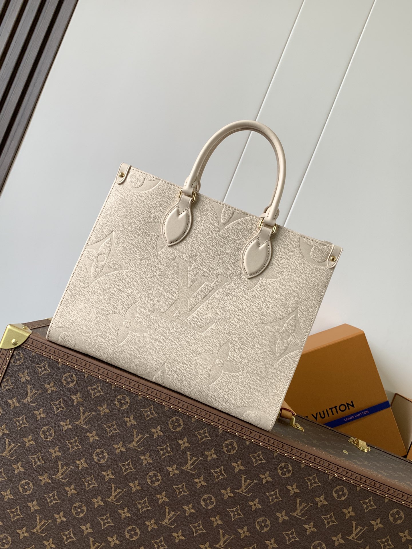 Onthego Mm Monogram Empreinte Leather Sand M14255
