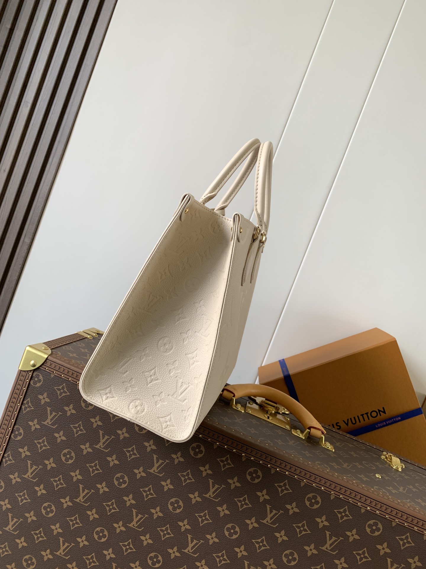 Onthego Mm Monogram Empreinte Leather Sand M14255