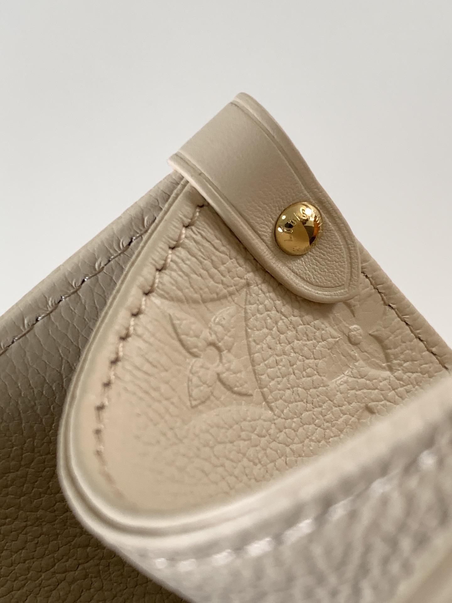 Onthego Mm Monogram Empreinte Leather Sand M14255