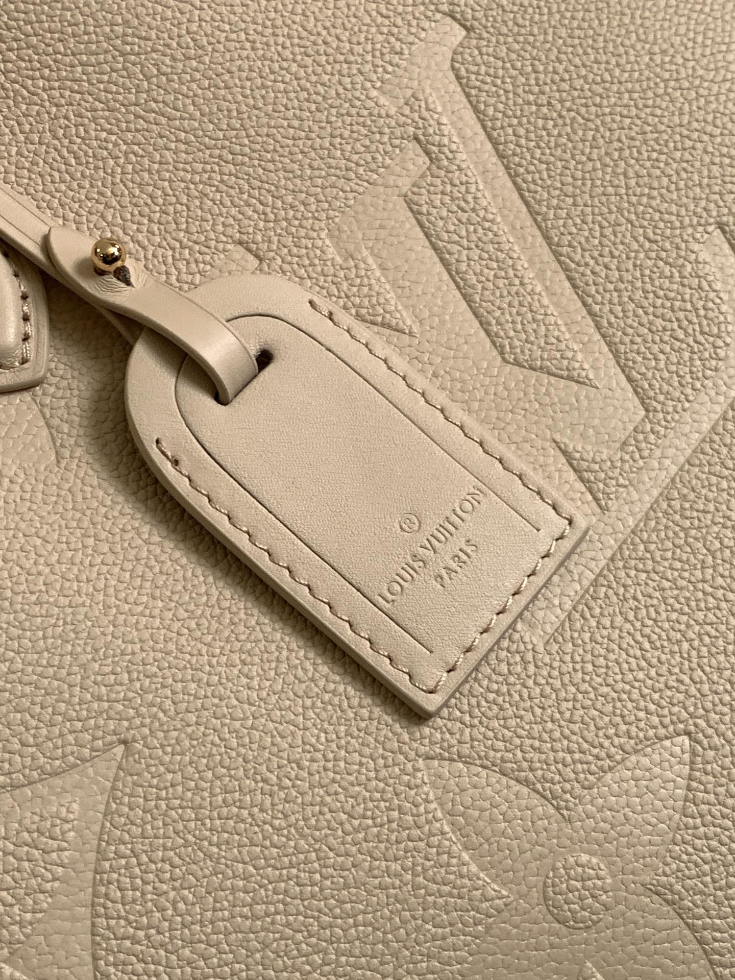 Onthego Mm Monogram Empreinte Leather Sand M14255
