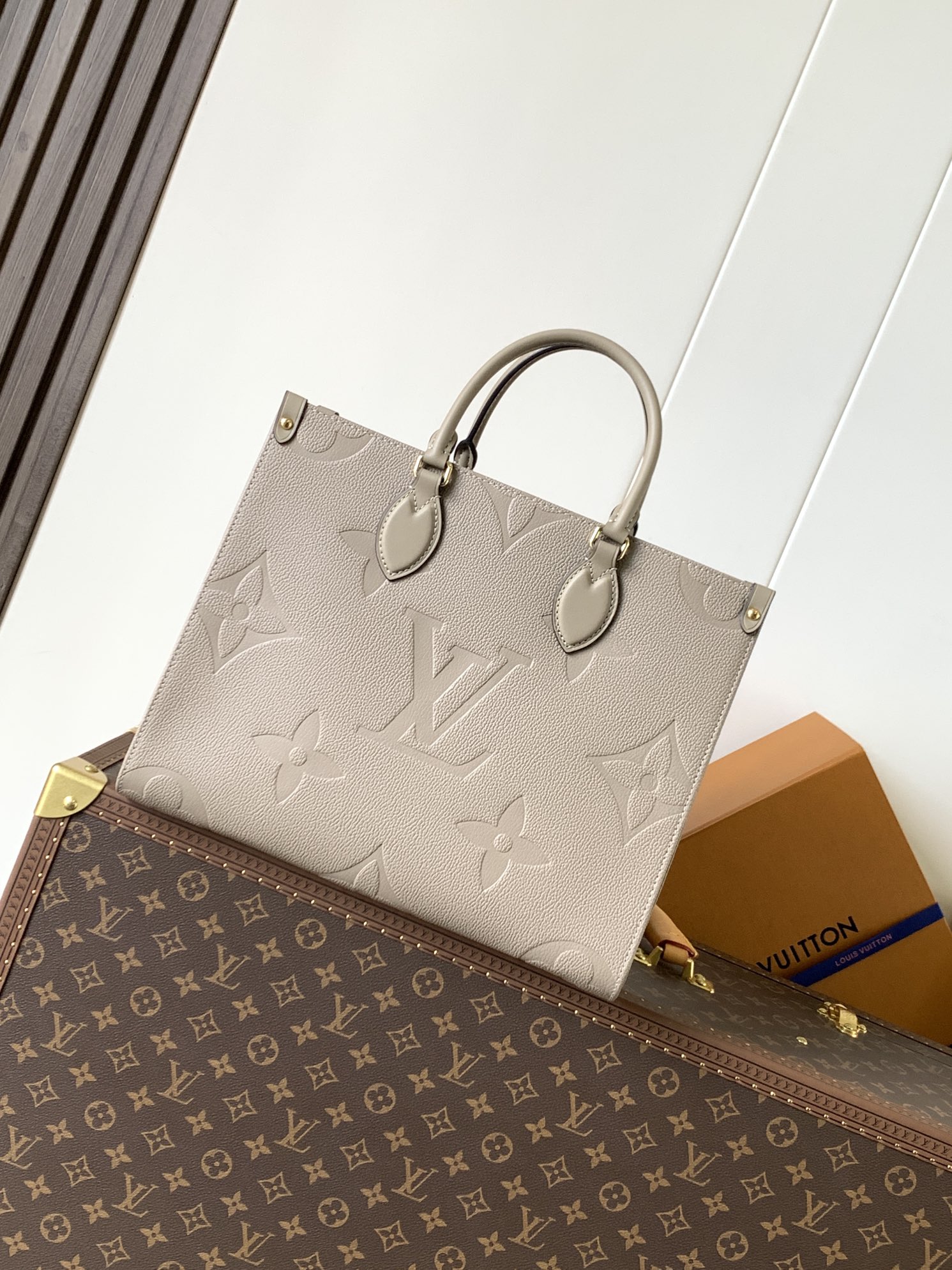 Onthego Mm Monogram Empreinte Leather Tourterelle Beige M45607