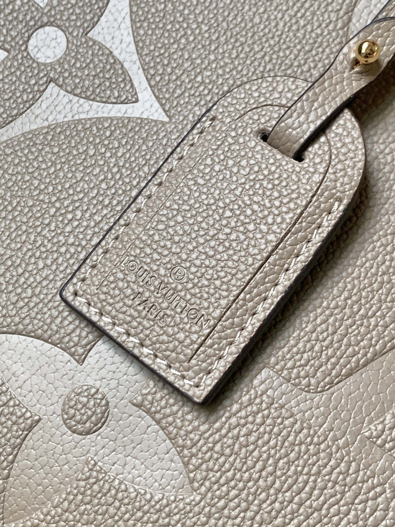 Onthego Mm Monogram Empreinte Leather Tourterelle Beige M45607