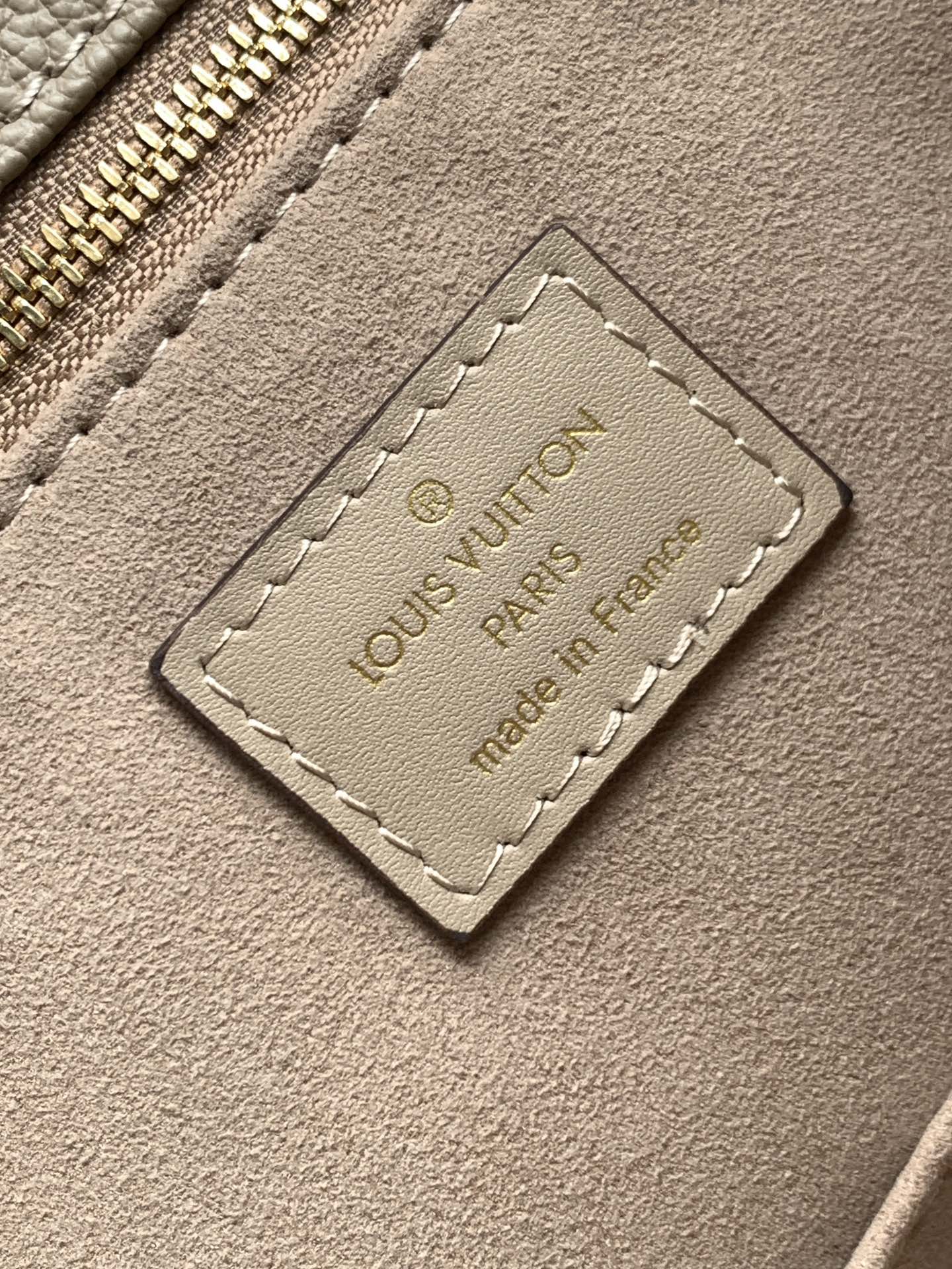 Onthego Mm Monogram Empreinte Leather Tourterelle Beige M45607