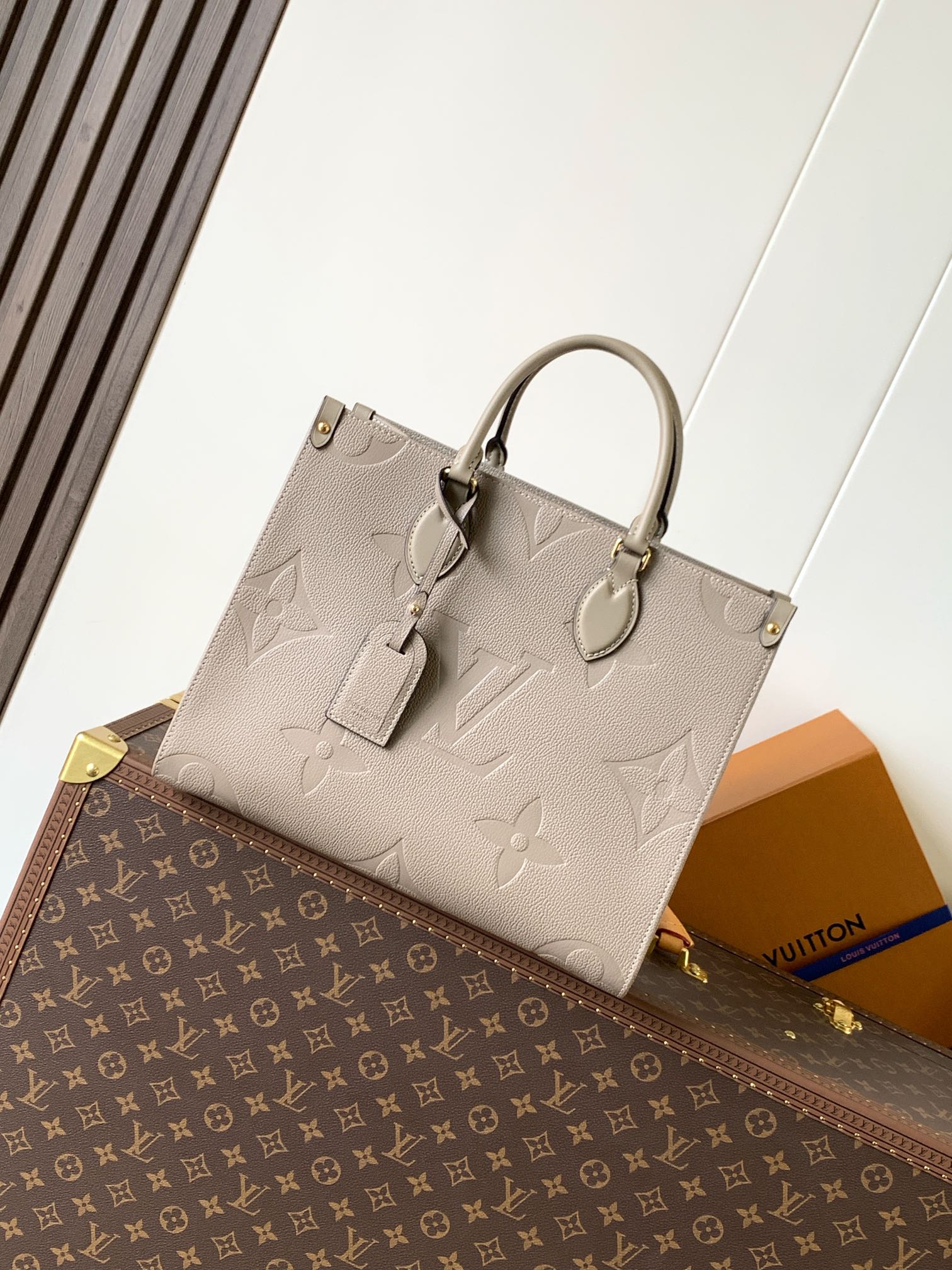Onthego Mm Monogram Empreinte Leather Tourterelle Beige M45607