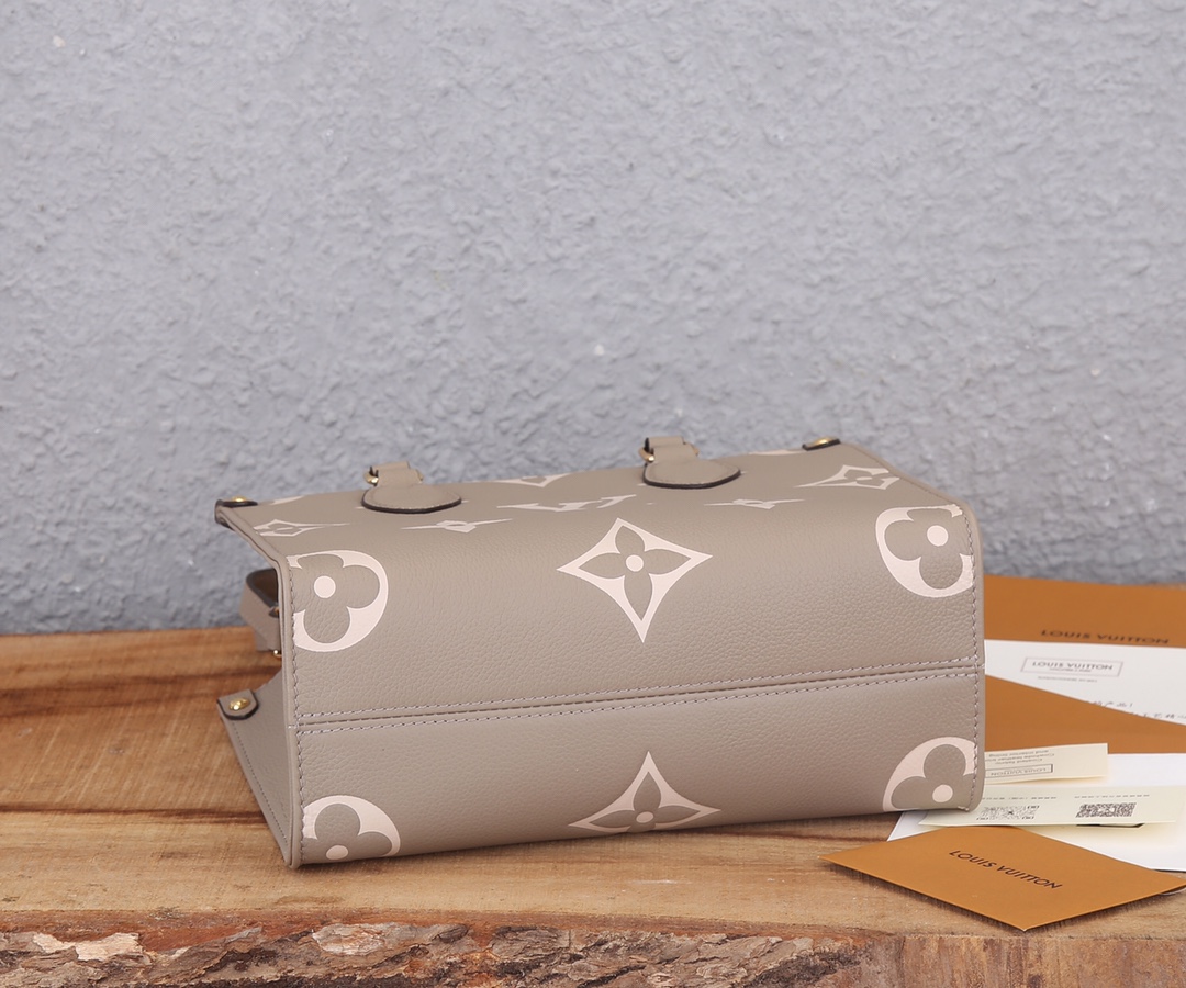 Onthego Pm Bicolor Monogram Empreinte Leather Dove/Cream M45779