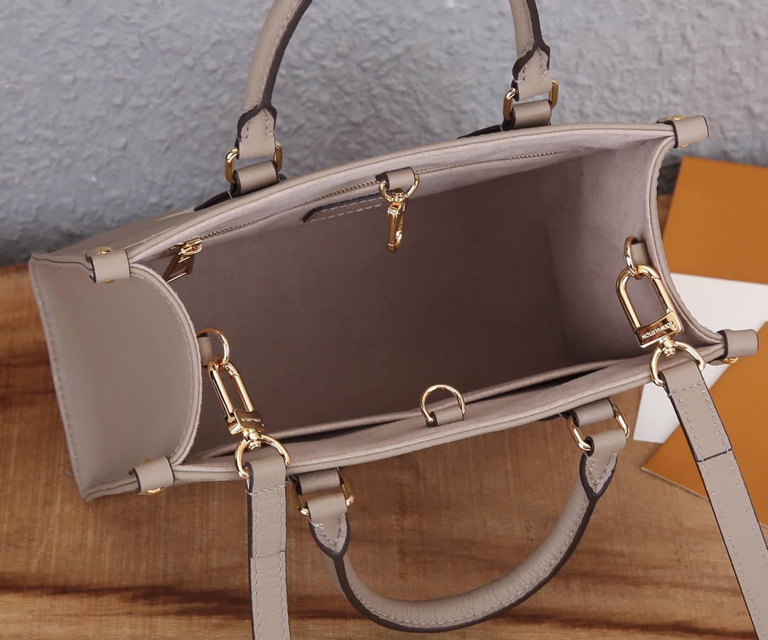 Onthego Pm Bicolor Monogram Empreinte Leather Dove/Cream M45779