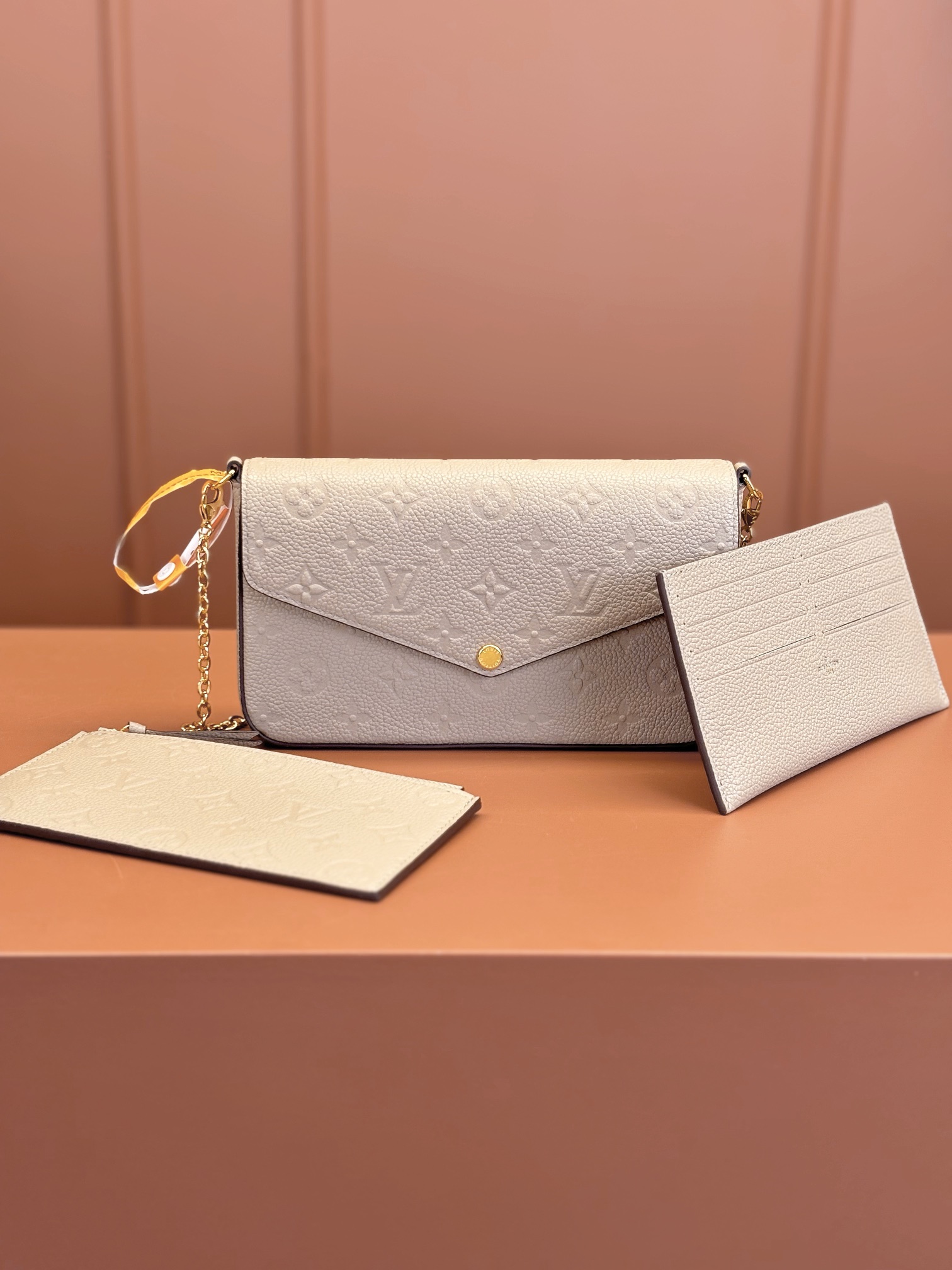 Pochette Félicie Monogram Empreinte Leather Turtledove M82609