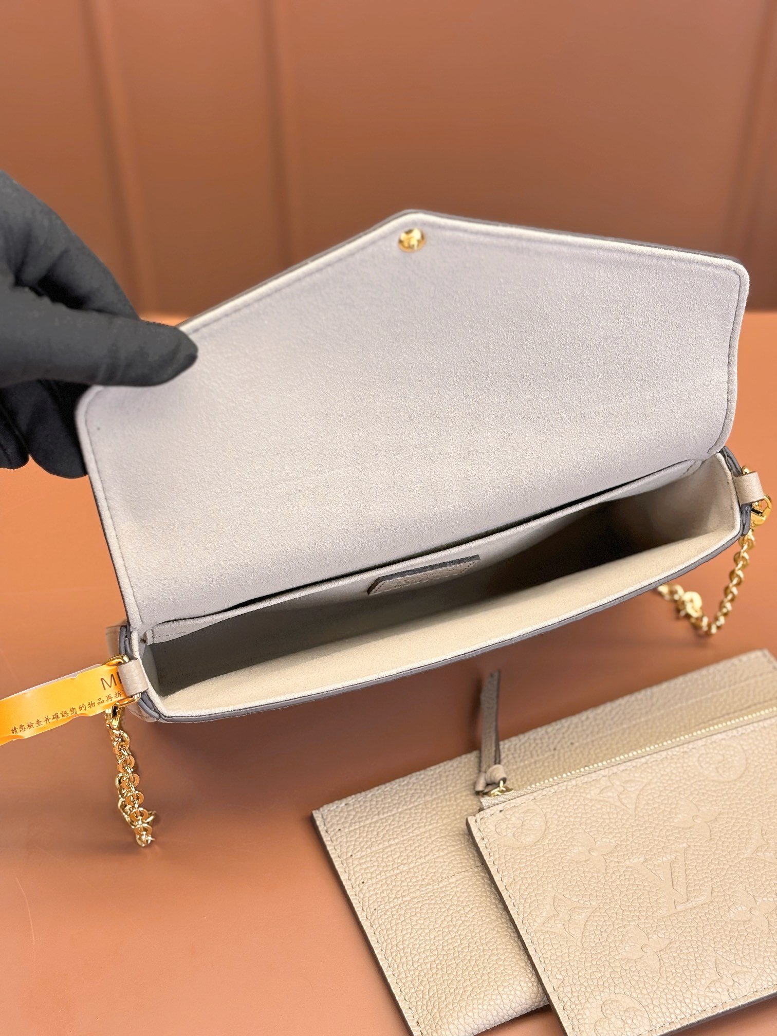 Pochette Félicie Monogram Empreinte Leather Turtledove M82609