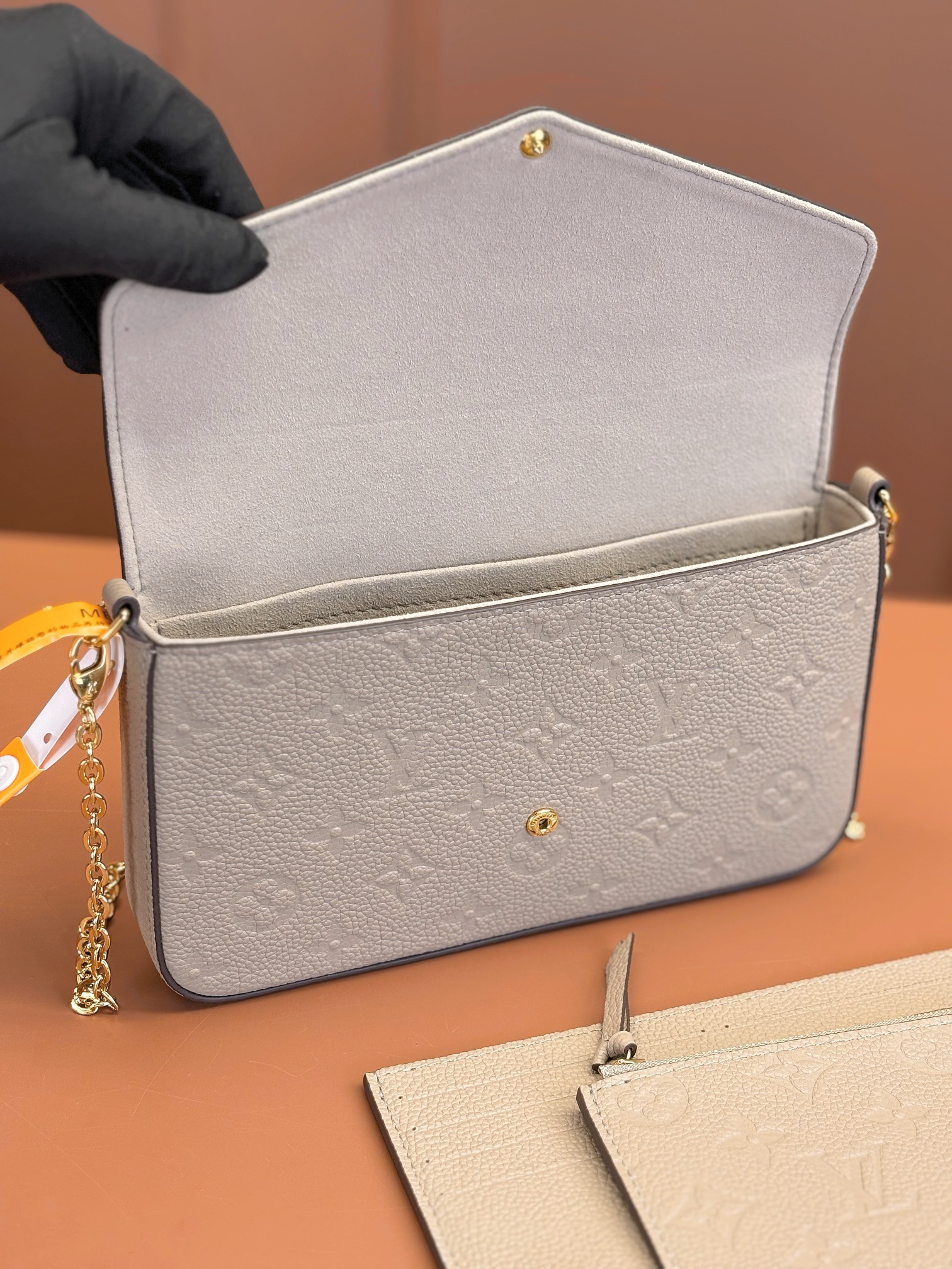 Pochette Félicie Monogram Empreinte Leather Turtledove M82609