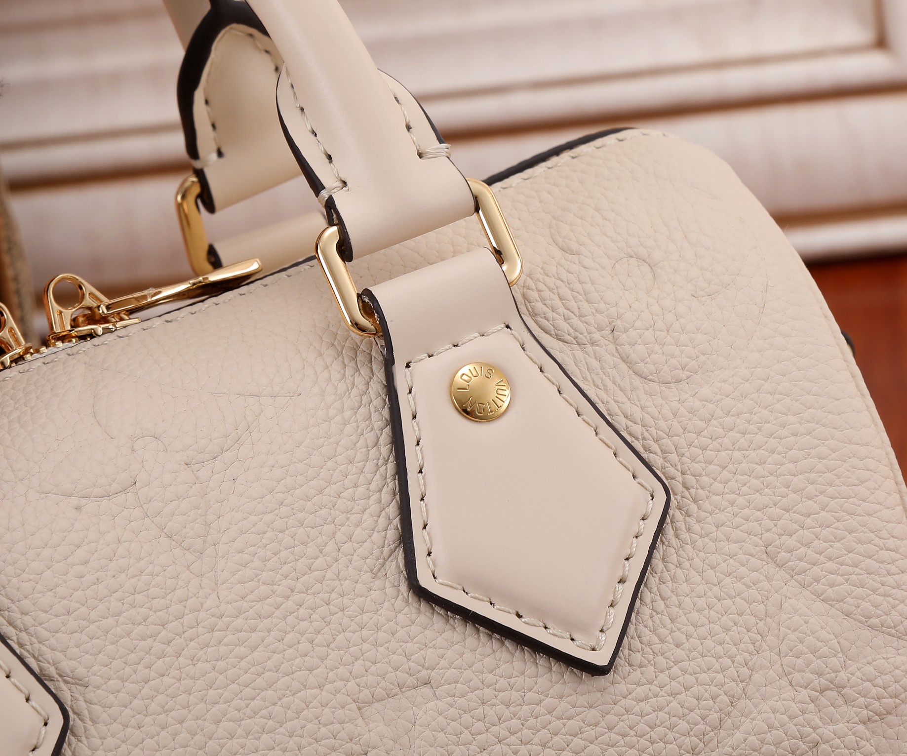 Speedy Bandoulière 20 Monogram Empreinte Leather Crème Beige M58954